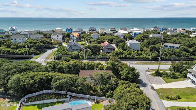 bird's eye view with a water view and a residential view