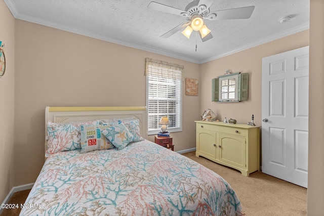 bedroom featuring a textured ceiling, light carpet, a ceiling fan, baseboards, and crown molding