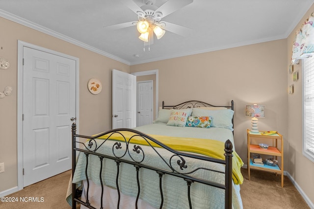 bedroom featuring ornamental molding, light colored carpet, baseboards, and a ceiling fan