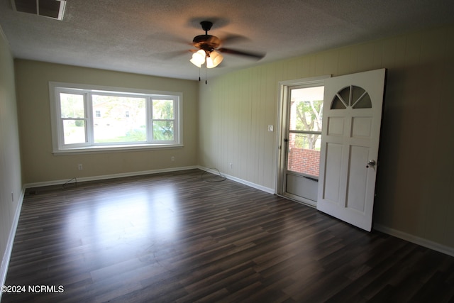 entrance foyer with hardwood / wood-style floors, ceiling fan, and a textured ceiling