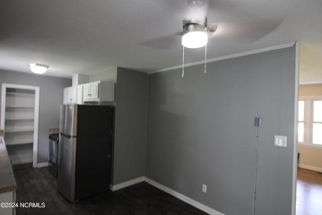 interior space featuring ceiling fan and dark wood-type flooring