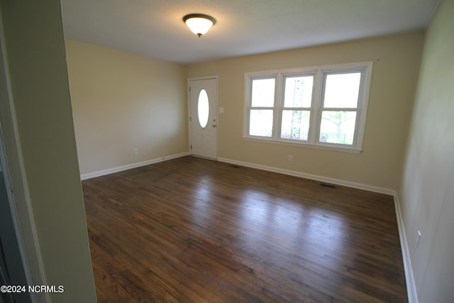 entryway with dark wood-type flooring