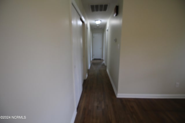 corridor featuring wood-type flooring