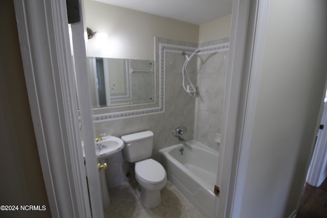 full bathroom featuring sink, toilet, shower / bathing tub combination, and tile patterned floors