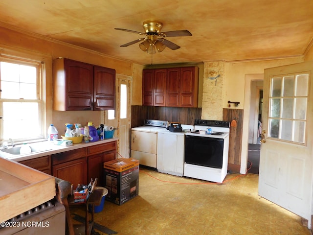 kitchen with range with electric stovetop, a sink, light countertops, ornamental molding, and washer and clothes dryer