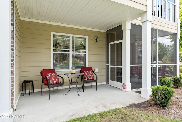 view of patio / terrace featuring a sunroom