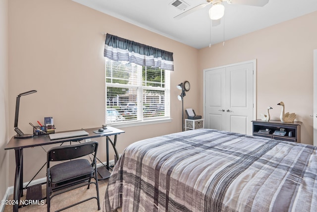 bedroom featuring baseboards, visible vents, ceiling fan, and a closet