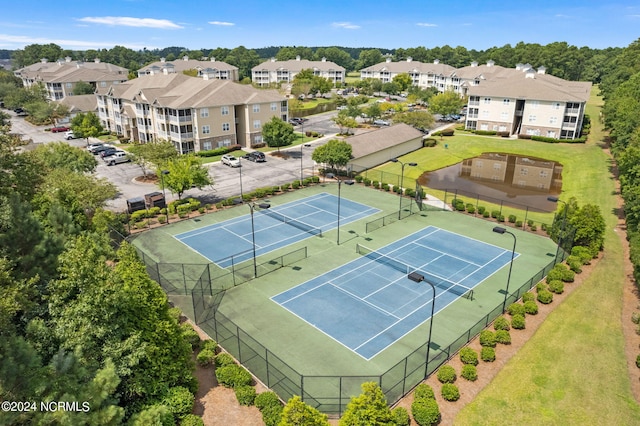 exterior space with fence and a residential view