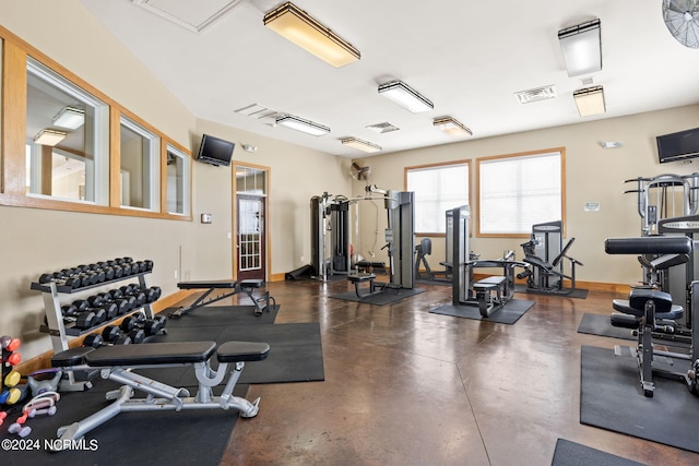 gym with baseboards and visible vents