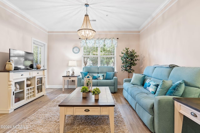 living area with light wood-type flooring, a wealth of natural light, and crown molding