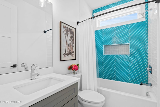 full bathroom with vanity, toilet, and shower / tub combo with curtain