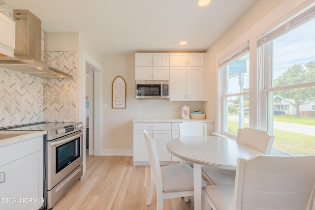 dining room with light hardwood / wood-style floors