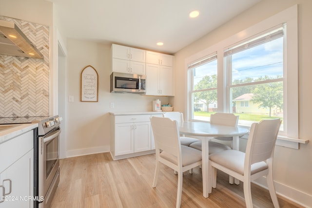 dining space featuring light wood-type flooring