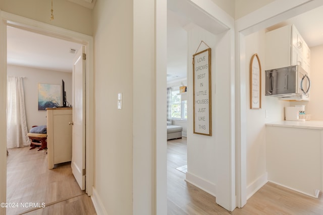 hall with light hardwood / wood-style flooring