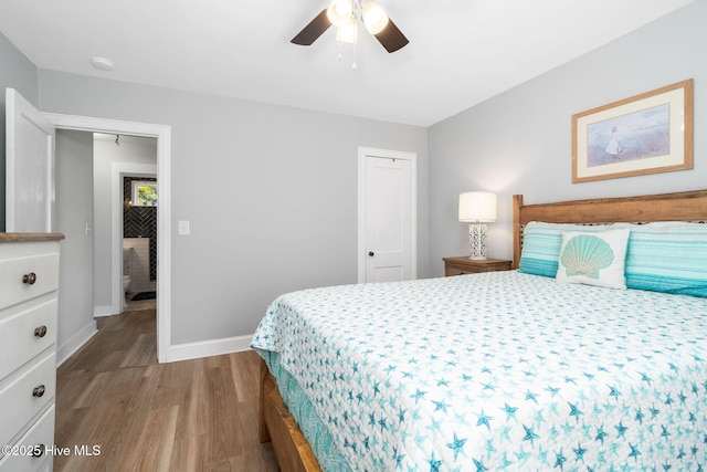 bedroom featuring wood-type flooring and ceiling fan