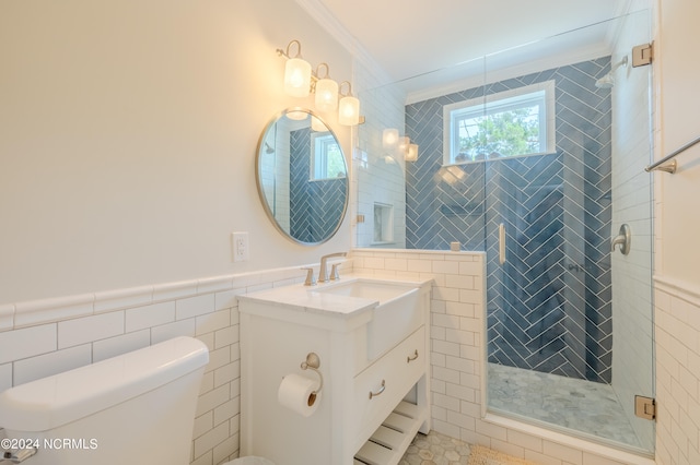 bathroom featuring tile walls, vanity, and toilet