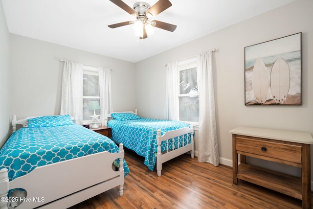 bedroom with ceiling fan and wood-type flooring