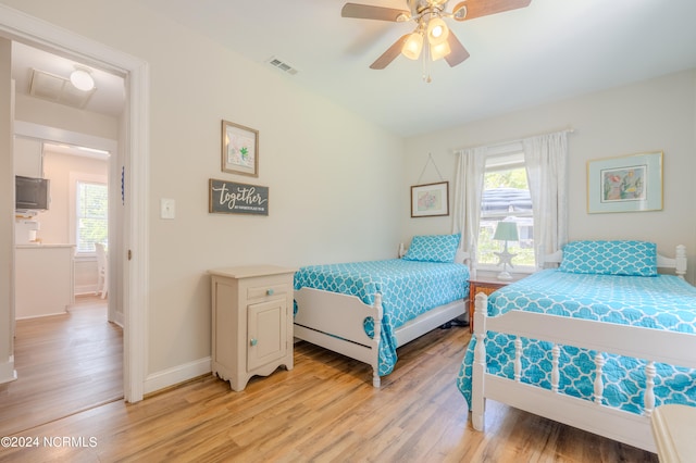 bedroom featuring ceiling fan and light wood-type flooring