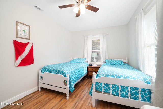 bedroom featuring hardwood / wood-style flooring and ceiling fan