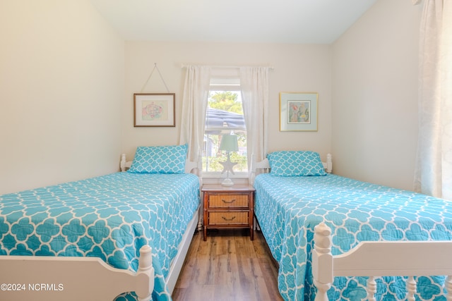 bedroom with hardwood / wood-style floors