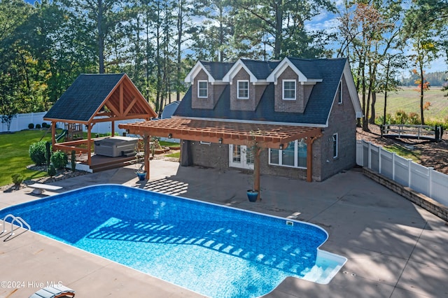 view of swimming pool with a hot tub, a gazebo, and a patio area