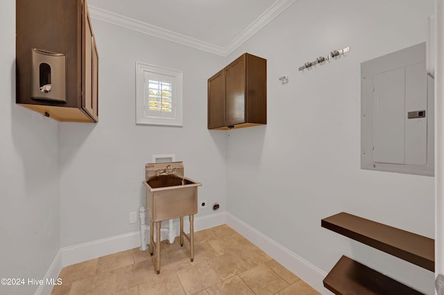 laundry room featuring electric panel, electric dryer hookup, cabinets, ornamental molding, and hookup for a washing machine