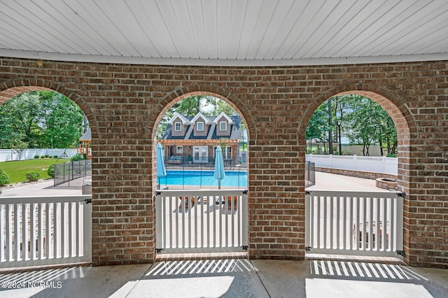 view of patio featuring a community pool