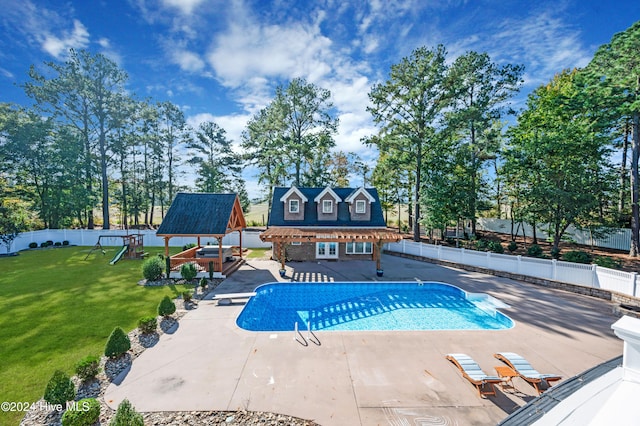 view of swimming pool featuring a playground, a lawn, a patio, and a gazebo