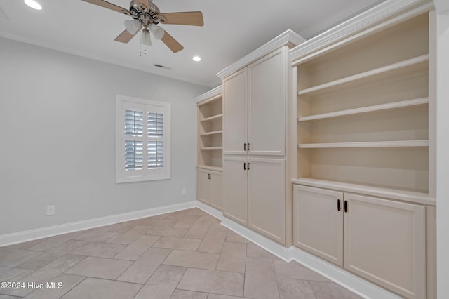 interior space with light tile patterned flooring and ceiling fan