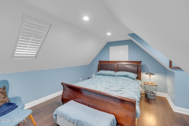 bedroom featuring vaulted ceiling and dark hardwood / wood-style flooring