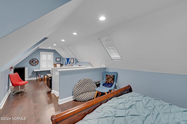 bedroom with dark wood-type flooring and vaulted ceiling