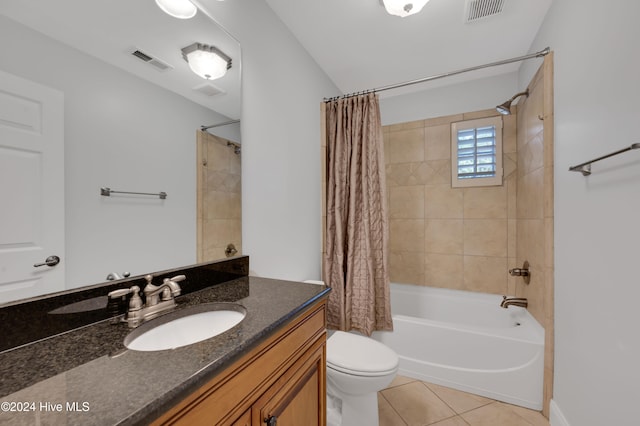 full bathroom with toilet, shower / tub combo with curtain, vanity, and tile patterned flooring