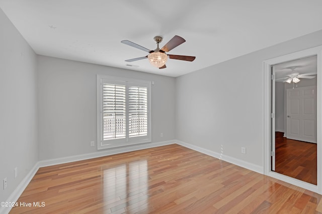 unfurnished room featuring light hardwood / wood-style flooring and ceiling fan