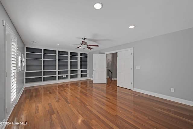 unfurnished living room with hardwood / wood-style floors and ceiling fan