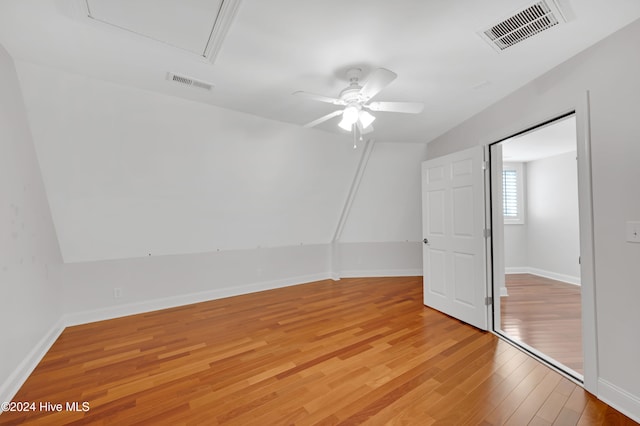 unfurnished bedroom featuring light wood-type flooring and ceiling fan