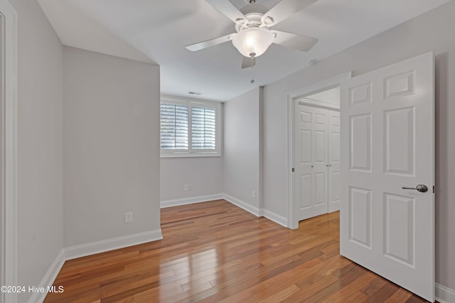 unfurnished bedroom with a closet, ceiling fan, and light hardwood / wood-style floors