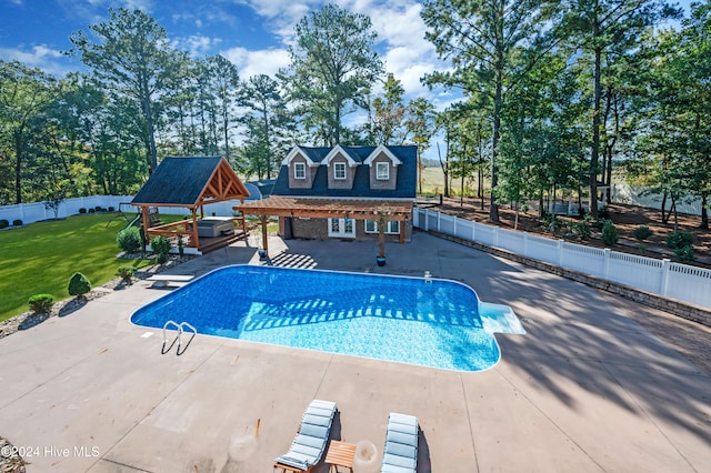 view of swimming pool with a patio and a yard