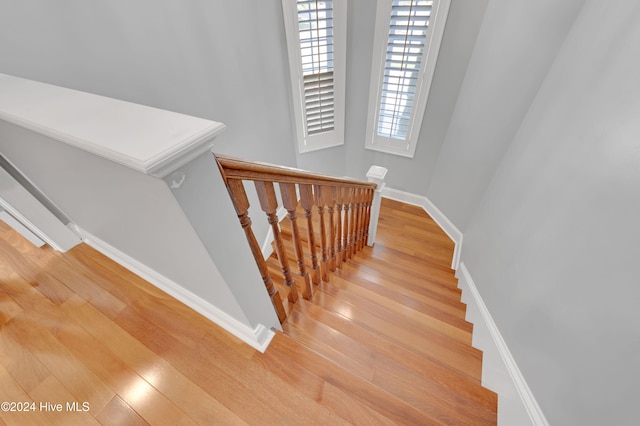 stairs featuring wood-type flooring