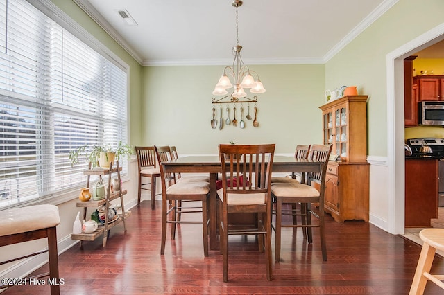 dining area with crown molding, dark hardwood / wood-style flooring, and a chandelier