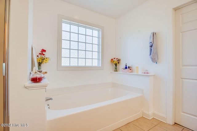 bathroom featuring tile patterned flooring and a bathtub