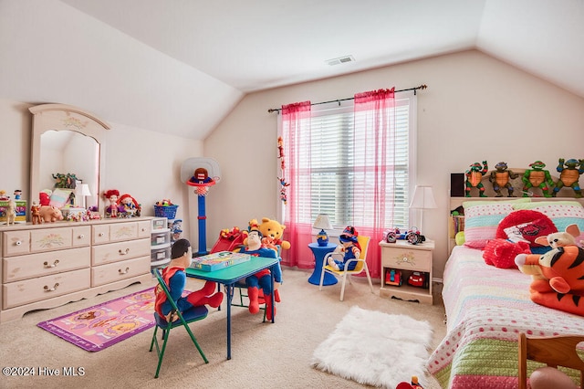 bedroom with carpet floors and lofted ceiling