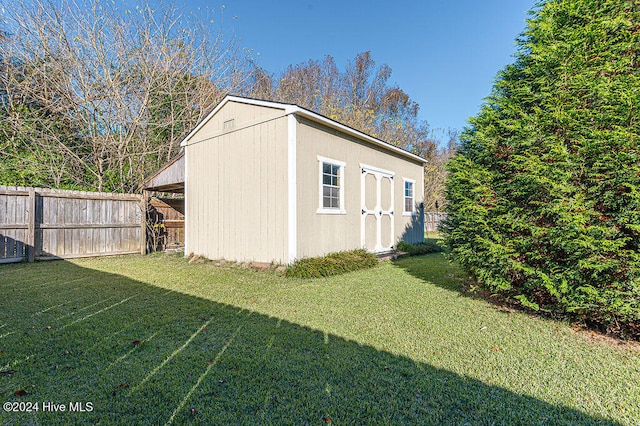 view of outdoor structure with a lawn