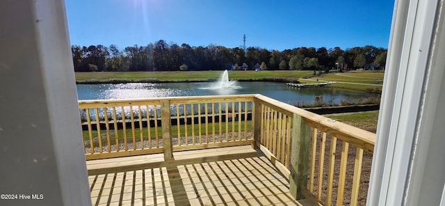 wooden deck with a water view