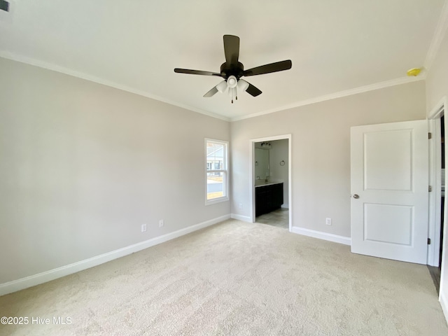 unfurnished bedroom featuring crown molding, light colored carpet, and ensuite bathroom