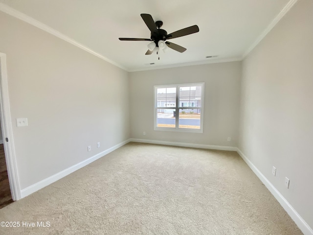 unfurnished room with crown molding, ceiling fan, and carpet flooring