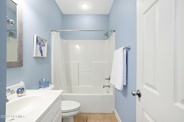 corridor featuring visible vents, wood finished floors, an upstairs landing, and baseboards