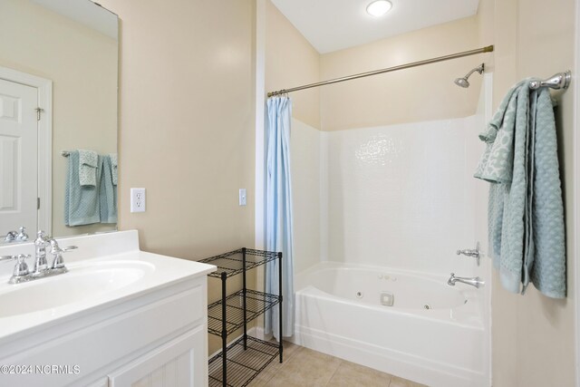 bathroom featuring tile patterned flooring, vanity, and shower / tub combo with curtain