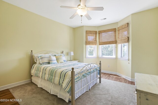 bedroom featuring wood-type flooring and ceiling fan