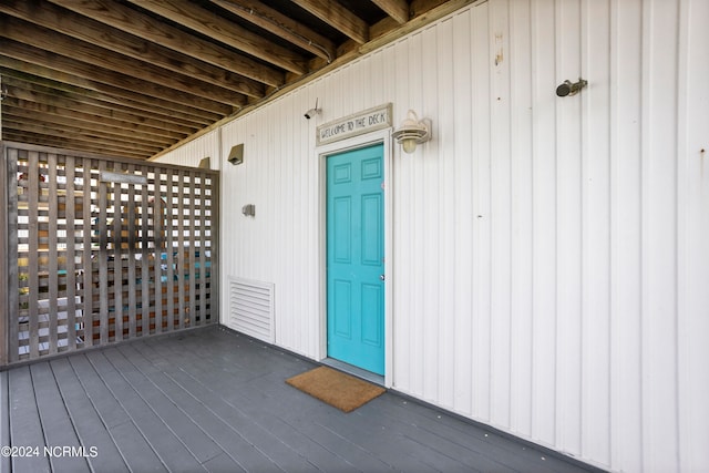 entrance to property with a wooden deck