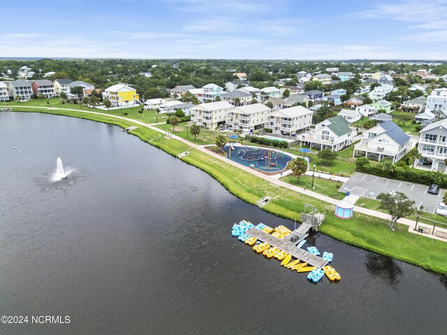 bird's eye view featuring a water view and a city view